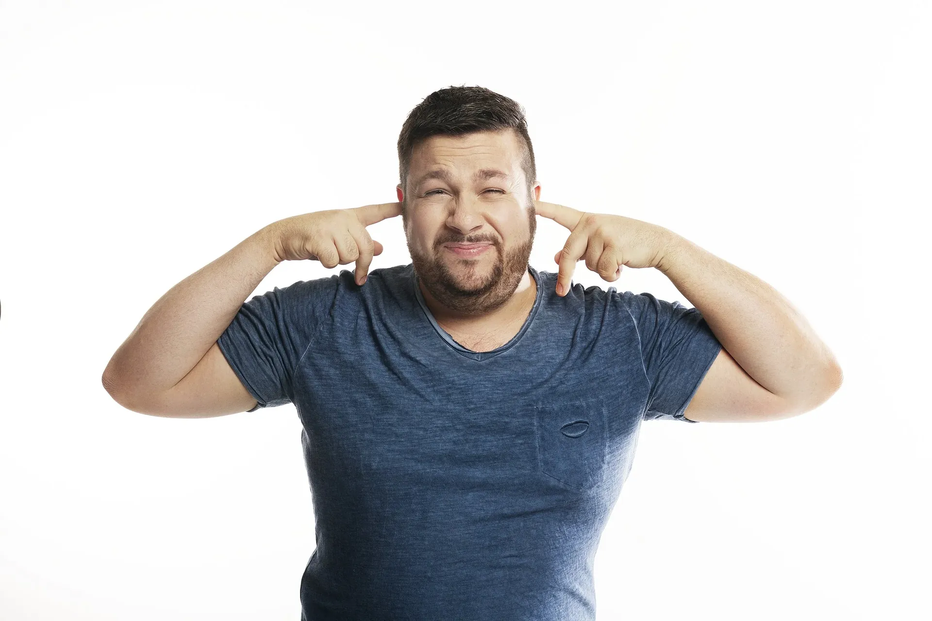 Christian Hull with fingers in his ears