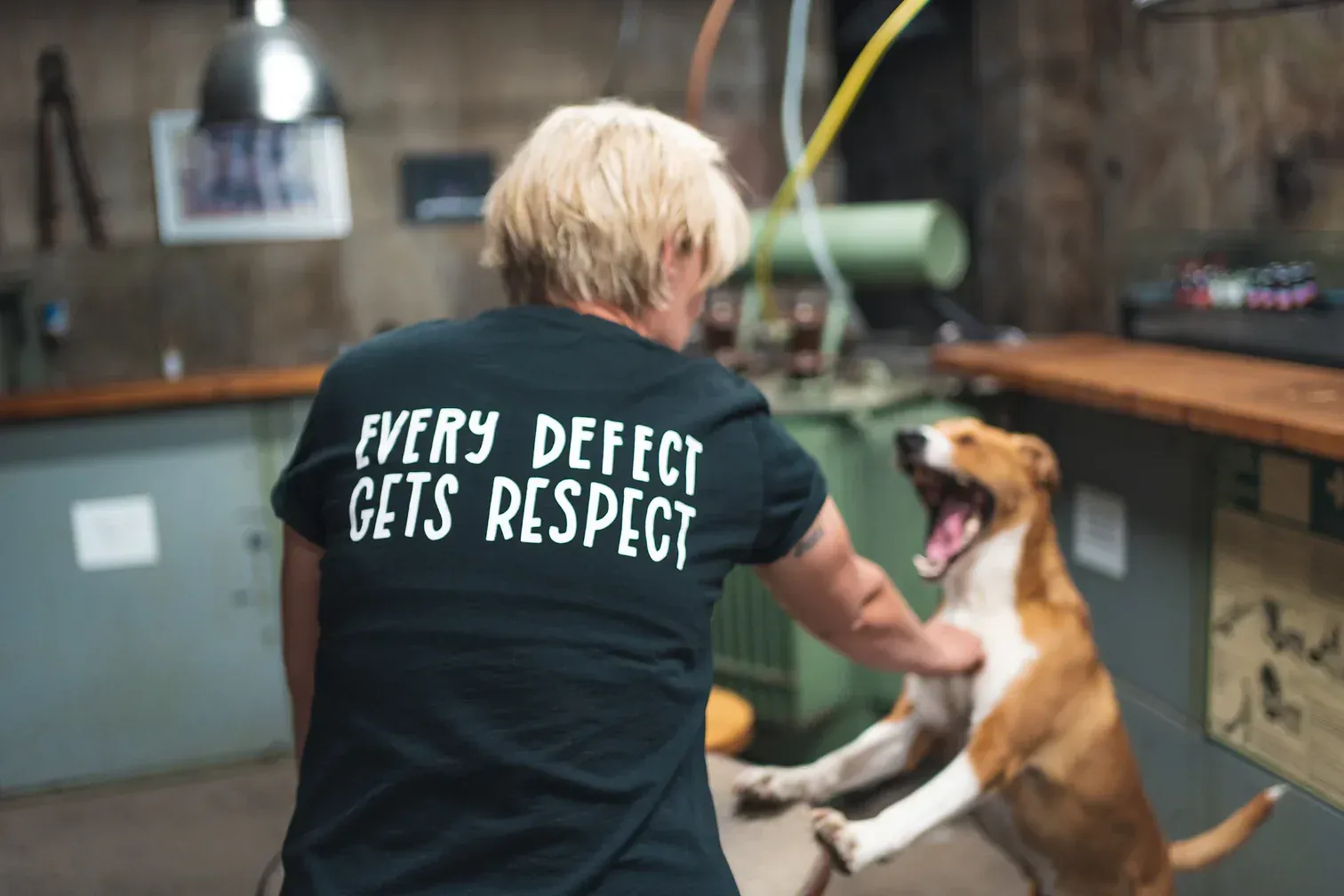 Laura Kampf in her workshop with her dog
